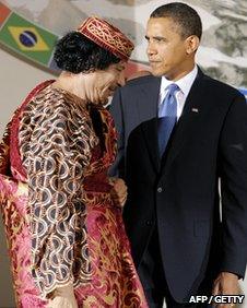 Colonel Gaddafi and US President Barack Obama standing together