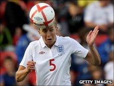 England captain Faye White heads the ball
