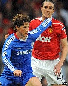 Chelsea striker Fernando Torres battles with Manchester United defender John O'Shea