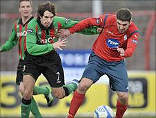 Glentoran's Sean Ward in action against Stephen Carson of Coleraine