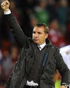 Swansea boss Brendan Rodgers punches the air after their battling draw at Forest