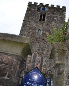 Clock restorers at Conwy