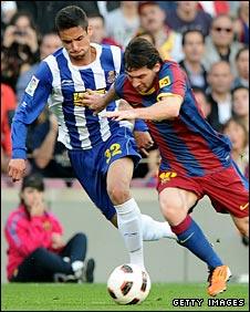 Raul Rodriguez chases Barcelona's Lionel Messi