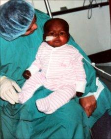 Khadija as a baby in hospital with her mother