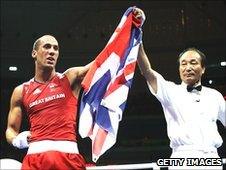 Britain's James DeGale (left) is awarded victory in Beijing