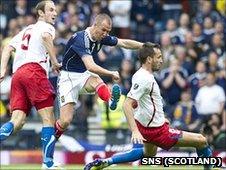 Kenny Miller scores