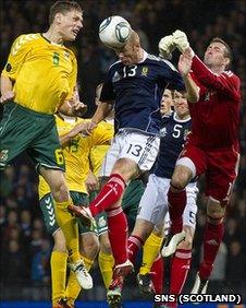 Stephen Crainey heads clear in the closing stages at Hampden