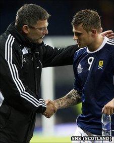 Scotland boss Craig Levein congratulates striker David Goodwillie