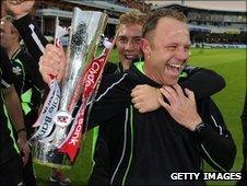 Surrey cricket manager Chris Adams is embraced by captain Rory Hamilton-Brown