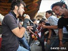 Performer and crowd at Kabul rock festival