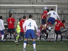 Craig Dawson heads in England's opener