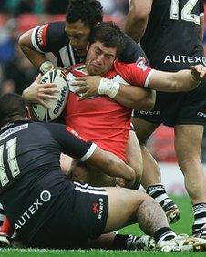 Wales' Danny Jones is stopped in his tracks by the New Zealand defence