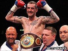 Ricky Burns is held aloft by his team