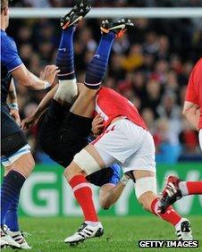 Wales captain Sam Warburton upends France wing Vincent Clerc in the World Cup