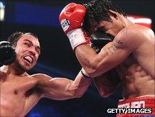 Juan Manuel Marquez lands a left on Manny Pacquiao