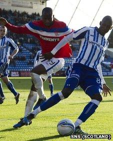 Rangers' Sone Aluko and Mohamed Sissoko of Kilmarnock