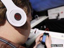 Man playing game on smartphone