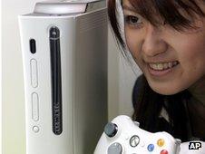 Girl looks at Xbox