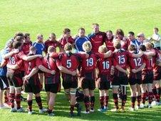 Jersey team huddle