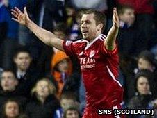 Kari Arnason celebrates scoring for Aberdeen against Rangers