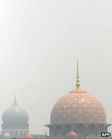 The dome of the landmark Putra Mosque (right) in Kuala Lumpur