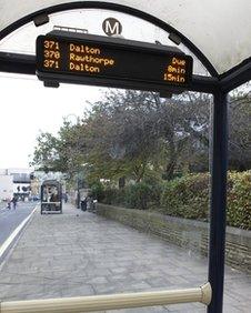 "yournextbus" in a bus shelter in Huddersfield