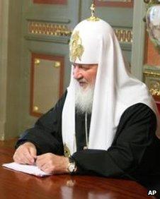 Patriarch Kirill sits at table