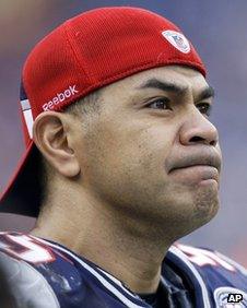 New England Patriots linebacker Junior Seau stands on the side lines against the Jacksonville Jaguars during an NFL football game, 2009