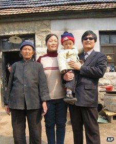 Handout picture from China Aid Association of Chen Guangcheng, with his son, Chen Kerui, his wife Yuan Weijing, and his mother in Shandong province, China, undated