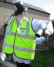 Scarecrow policeman with picture of Jeremy Clarkson's face