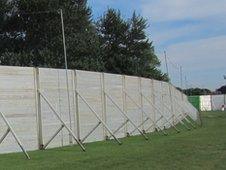 Two fences circle the site at the site at Hackney Marshes, east London