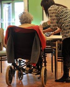 Elderly woman and her care worker