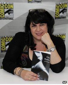 Author E L James poses with her book Fifty Shades of Grey