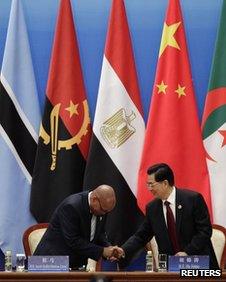 China's President Hu Jintao (R) shakes hands with South Africa's President Jacob Zuma during the opening ceremony of the Fifth Ministerial Conference of the Forum on China-Africa Cooperation (FOCAC) at the Great Hall of the People in Beijing, 19 July, 2012