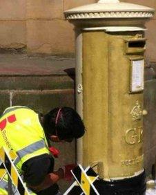 The post box being painted