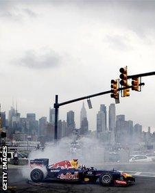 Former Red Bull Racing Formula 1 driver David Coulthard drives the Red Bull running show car for a video shoot on August 15 2012 in Weehawken