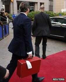 David Cameron carrying a ministerial red box in Brussels