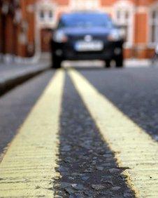 Car parked on double yellow lines