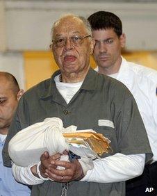 Dr Kermit Gosnell is escorted to a waiting police van upon leaving the Criminal Justice Center in Philadelphia, on 13 May 2013