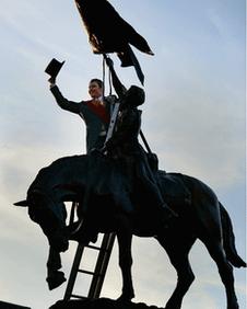 Cornet Chris Ritson was at the heart of the celebrations as he doffed his hat after tying ribbons on the 1514 memorial in the centre of Hawick.