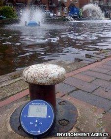 Aerators pumping oxygen into a canal in Kidderminster after a fire