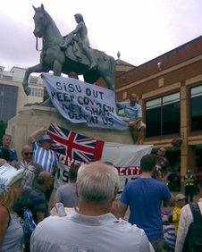 Coventry City supporters put a banner around Lady Godiva statue