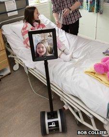 Child at Alder Hey hospital, Liverpool using an interactive robot