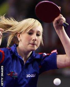 Charlotte Carey playing table tennis.