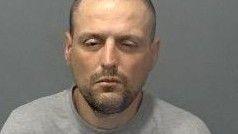 A police mugshot of Peter Janoski wearing a grey top