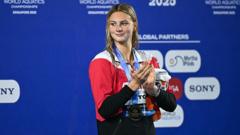 How Did McIntosh Secure Her Fourth Gold While Marchand Dominates the Medley?