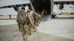A handout photo made available by the Bundeswehr shows soldiers before departure for the military evacuation operation in Al-Azraq, Jordan, 23 April 2023 (issued 24 April 2023). The German government has begun evacuating German citizens from Sudan, as heavy armed clashes between the military and rival paramilitay groups have been occurring in Khartoum and other parts of Sudan since 15 April 2023. The evacuation is being coordinated with the government of Jordan.