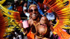 Notting Hill Carnival revellers party in the sunny streets