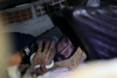 Abdulalim Muaini holds onto a rope as rescuers try to pull him out from under the rubble, in the aftermath of a deadly earthquake in Hatay, Turkey, February 8, 2023. 