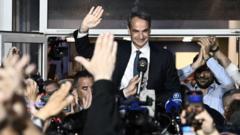 Prime Minister and New Democracy party's leader Kyriakos Mitsotakis celebrates with his supporters